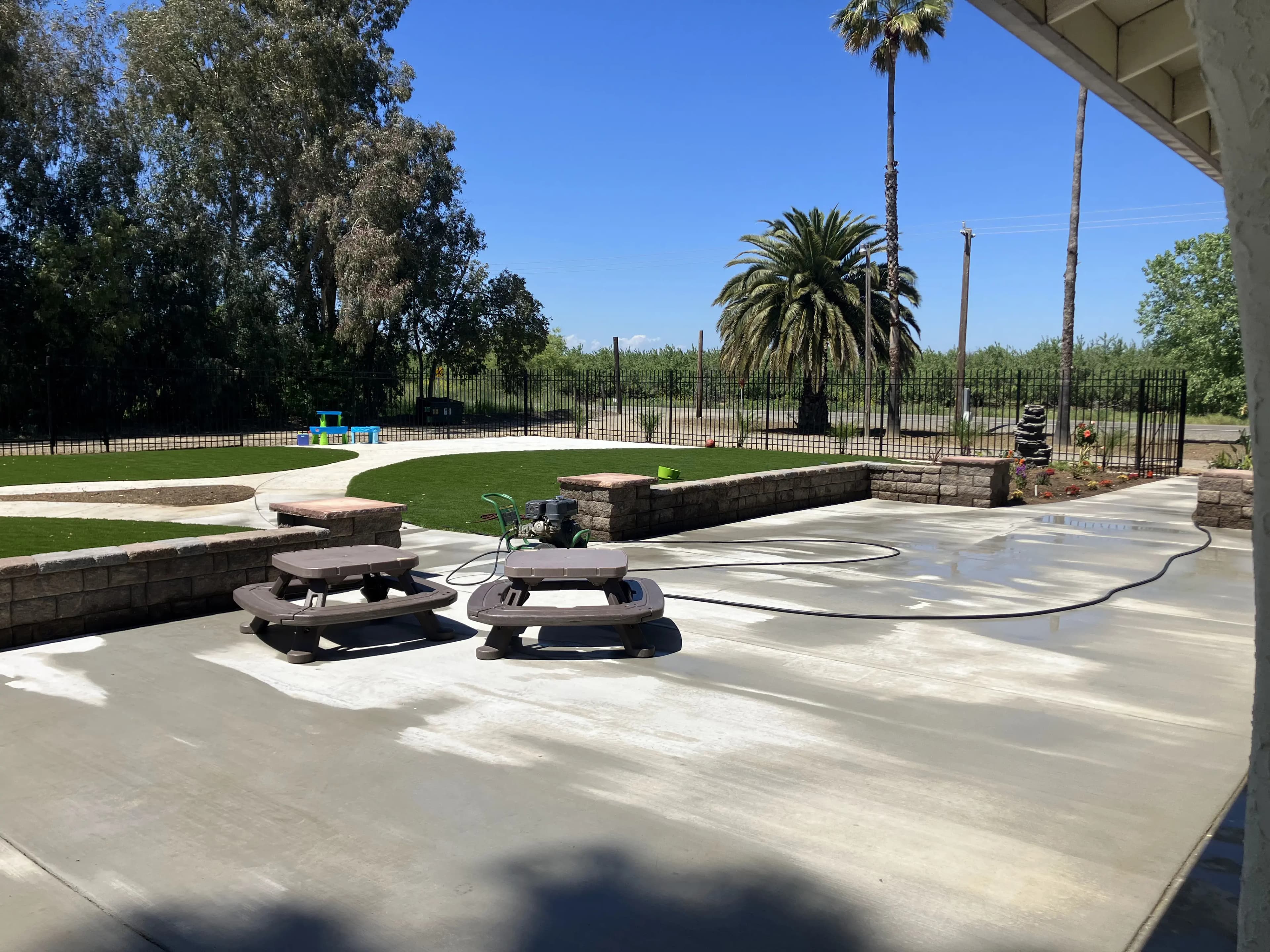 Concrete Patio With Surrounding Brick Walls