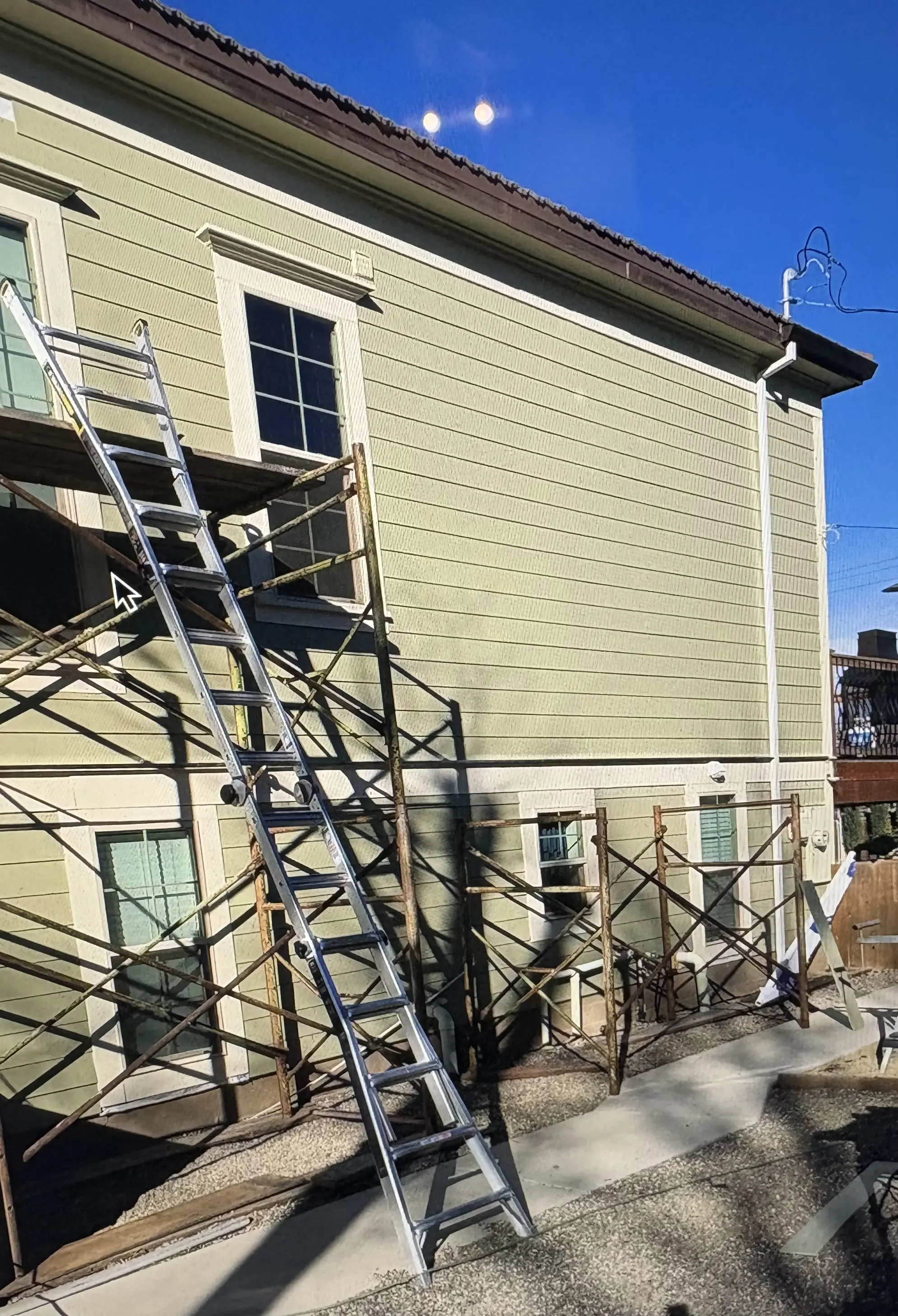 Modern house with new siding installation in a neutral tone